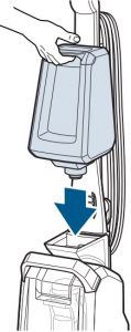 Placing the water tank onto the Bissell carpet cleaner